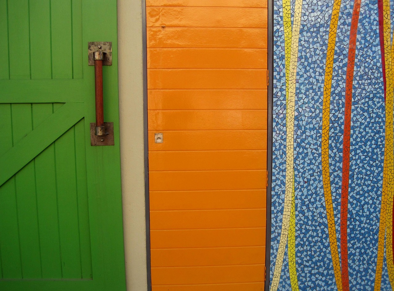 three panels, a green door, an orange panel, panel, blue, colorful
